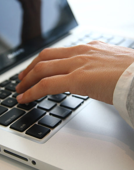 Hand on Laptop