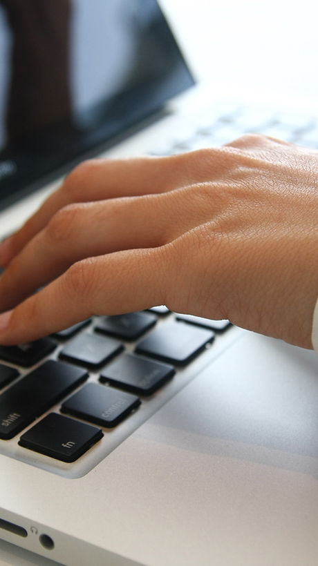 Hand on Laptop