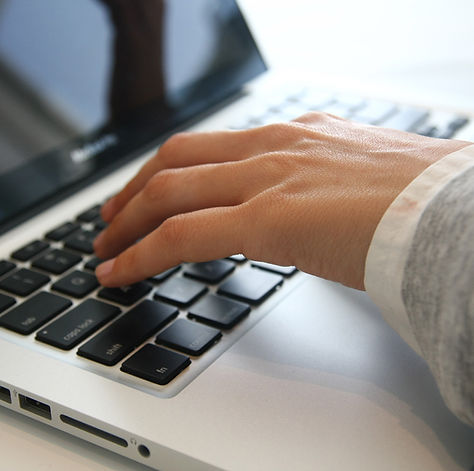 Hand on Laptop