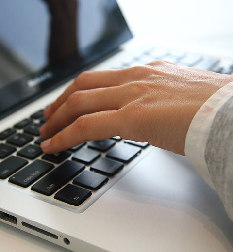 Hand on Laptop