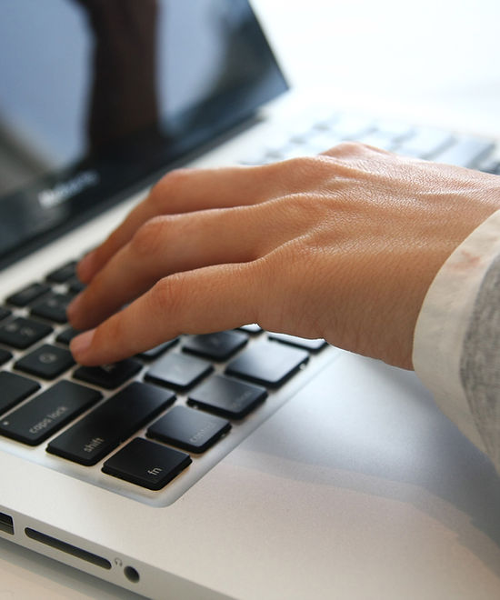 Hand on Laptop