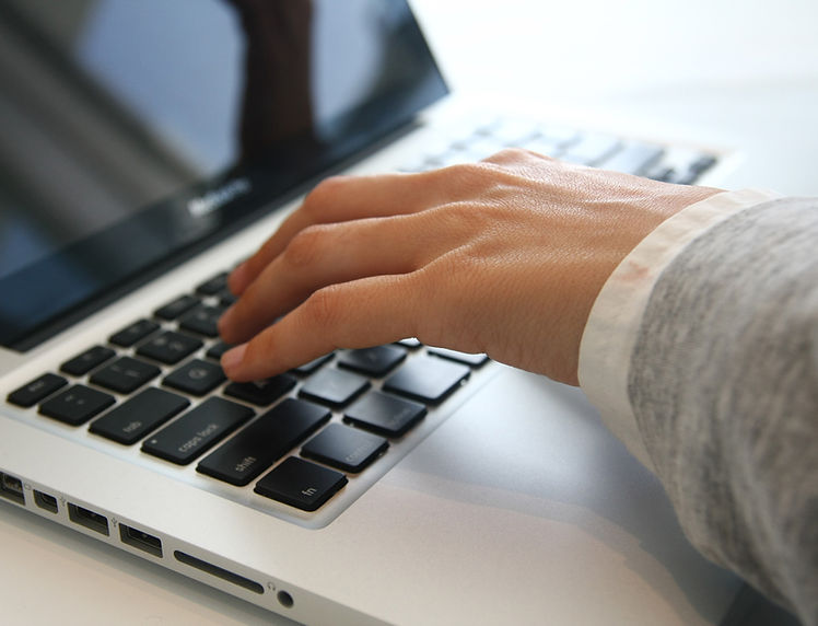 Hand on Laptop 