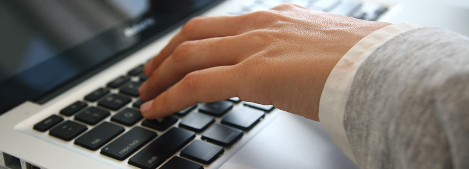 Hand on Laptop