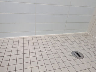 Cracked, mouldy deteriorating bathroom shower caulking removed and new shower silicone caulking professionally completed by HANDLD in Liberty Village, downtown Toronto