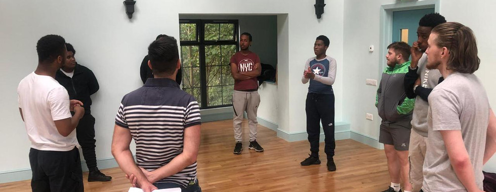 A picture of our youth club having a discussion in a circle.