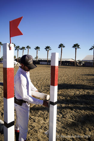 Chris Fellers sets a jump in a warm-up ring at Desert Horse Park