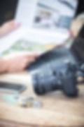 A camera and marketing brochures
