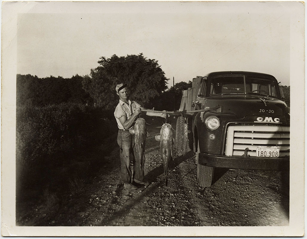 HUNKY MUSCULAR JEANS-WEARING FISHERMAN w BIG TRUCK and HUGE CATFISH CATCH