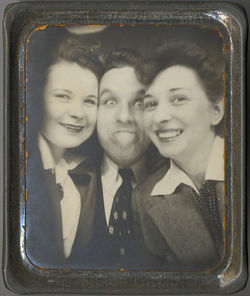 fp2426(PM_ManTwoWomen_StickingOutTongue)