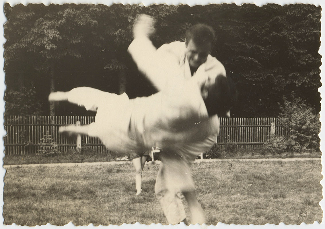 FABULOUS ACTION MAN THROWS ANOTHER DOWN JUDO BLACK BELT? WOMAN'S LEGS BEHIND