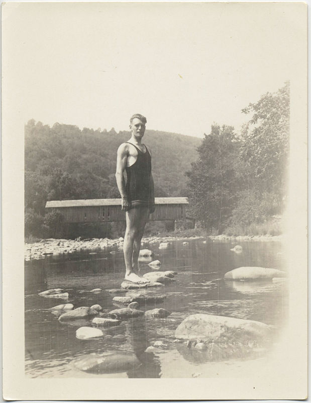 SWIMMER stands on ROCKS by COVERED BRIDGE!