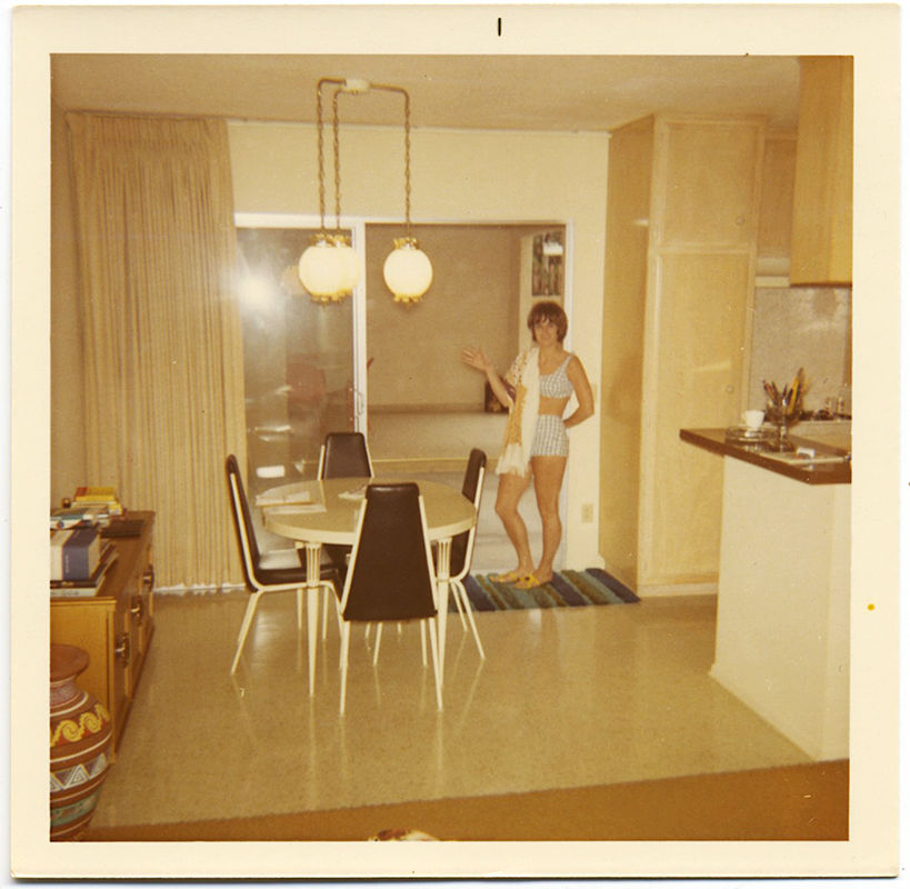 BIKINI TWO-PIECE SWIMSUIT WEARING WOMAN in MIDCENTURY MODERN KITCHEN DINING ROOM