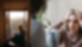 An introvert reading near a window and a socially anxious person stressing out during a conversation with another person.