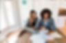 A woman having a one-on-one session with a life coach about methods to find friends and manage social anxiety as an introvert.
