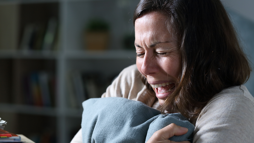 autistic woman crying and in intense emotional pain due to rejection sensitive dysphoria