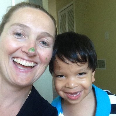 Image of our diretor with one of hr early ASD students smiling while enjoying her job.