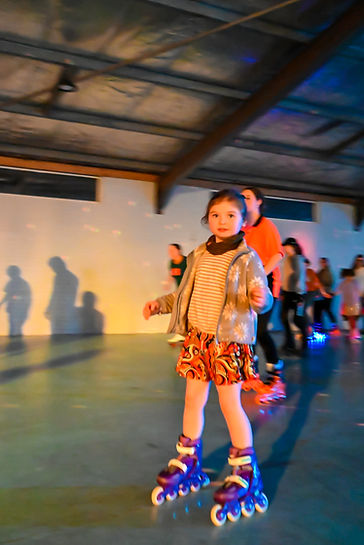 Young child skating at Rollerrama roller skating rink, Kalamunda.