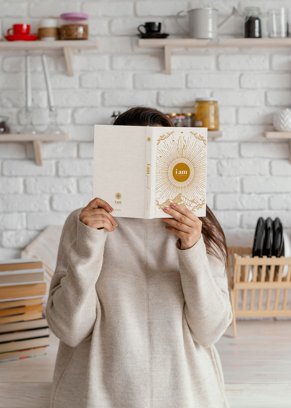 Medium shot of woman holding the I Am Journal 
