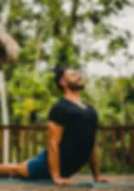Man doing yoga near luxury Belize Eco-lodge Copal Tree Lodge.webp