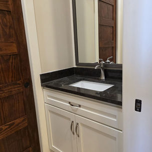 A new white cabinet with a sink.