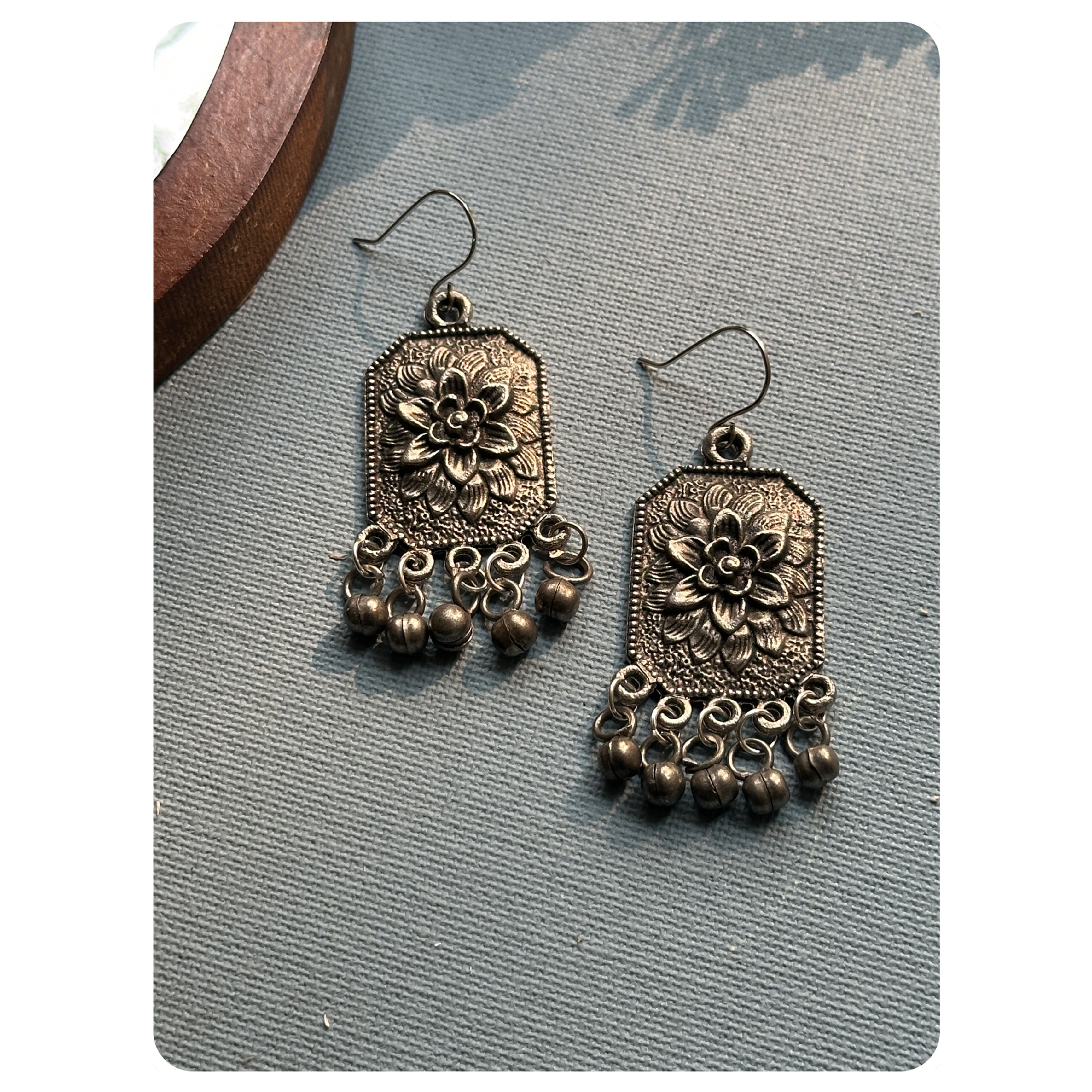 Black Oxidised Floral Engraved Ghungroo Earrings