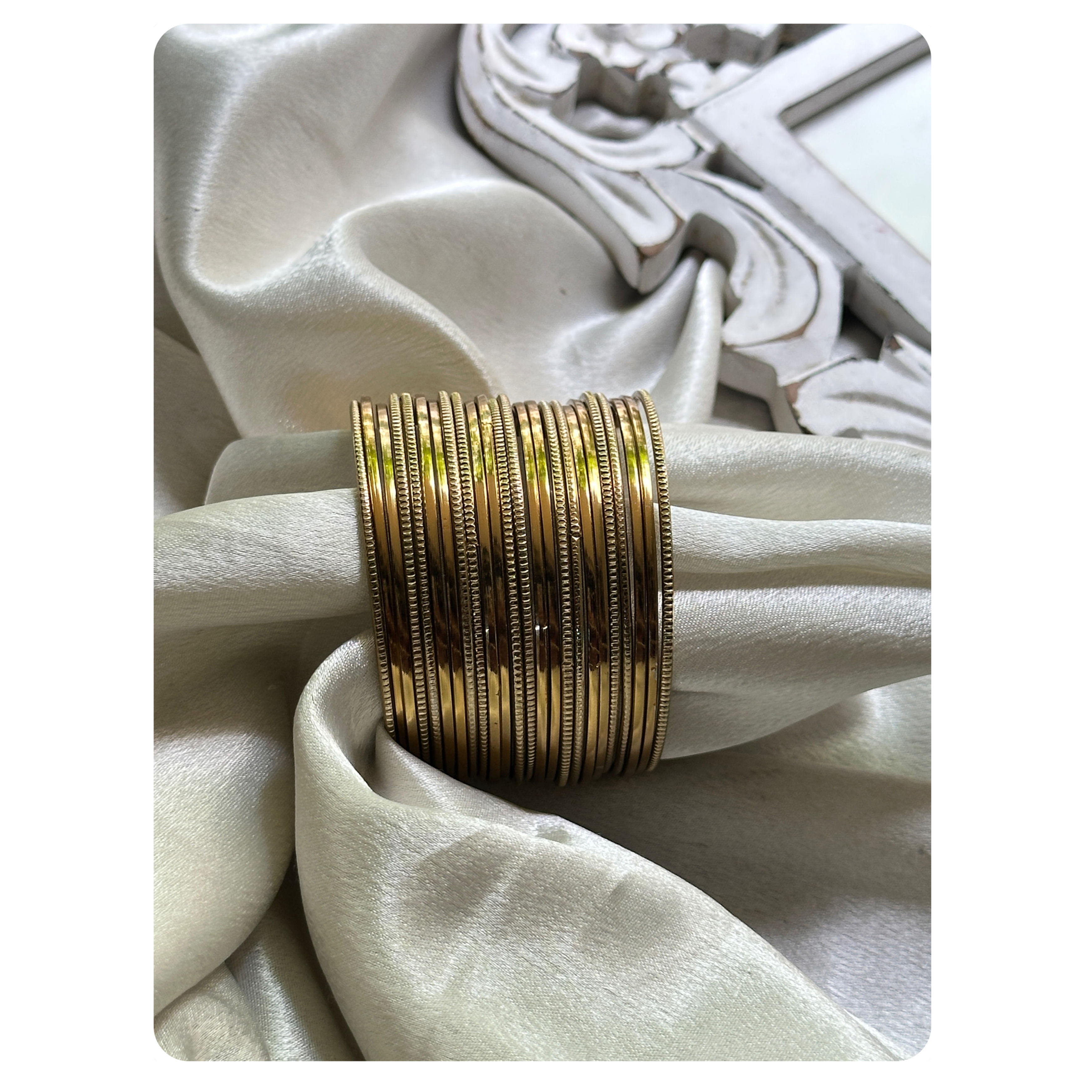 Gold Toned Line Striped and Plain Bangle Set (24 pieces) Size- 2.8