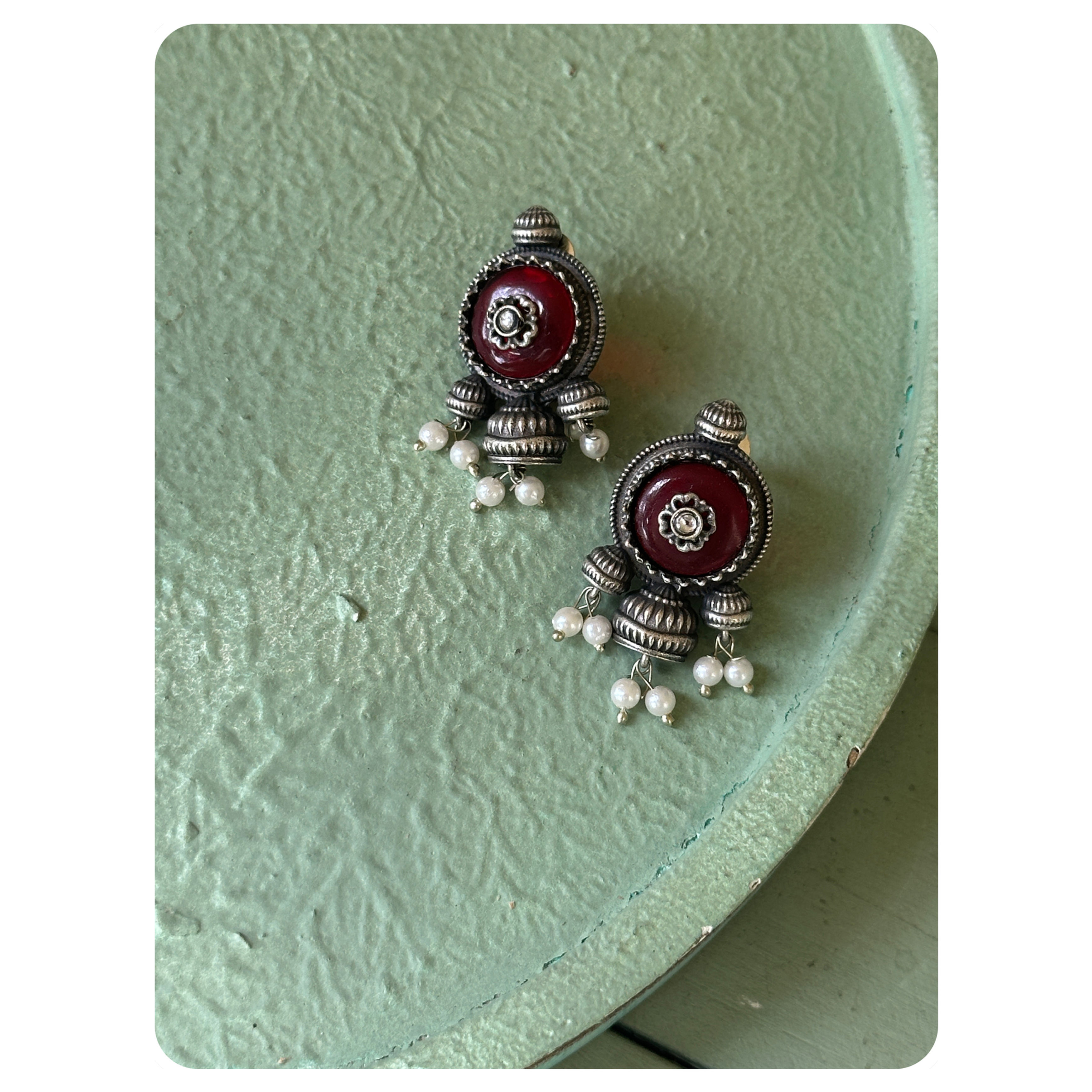 Silver Oxidised Ruby Stone With Floral Motif Embellished Stud
