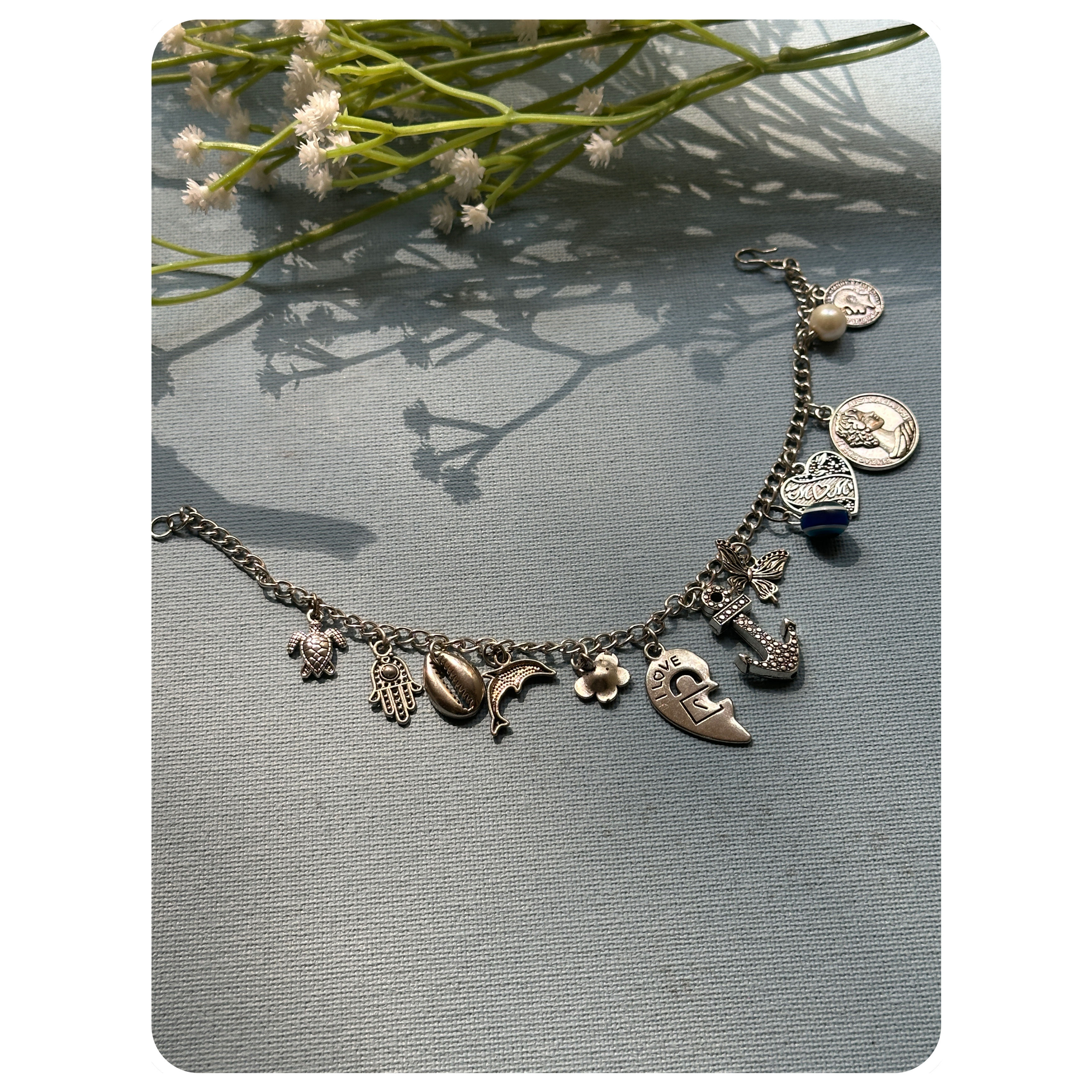 Silver Toned Mix Charm Bracelet