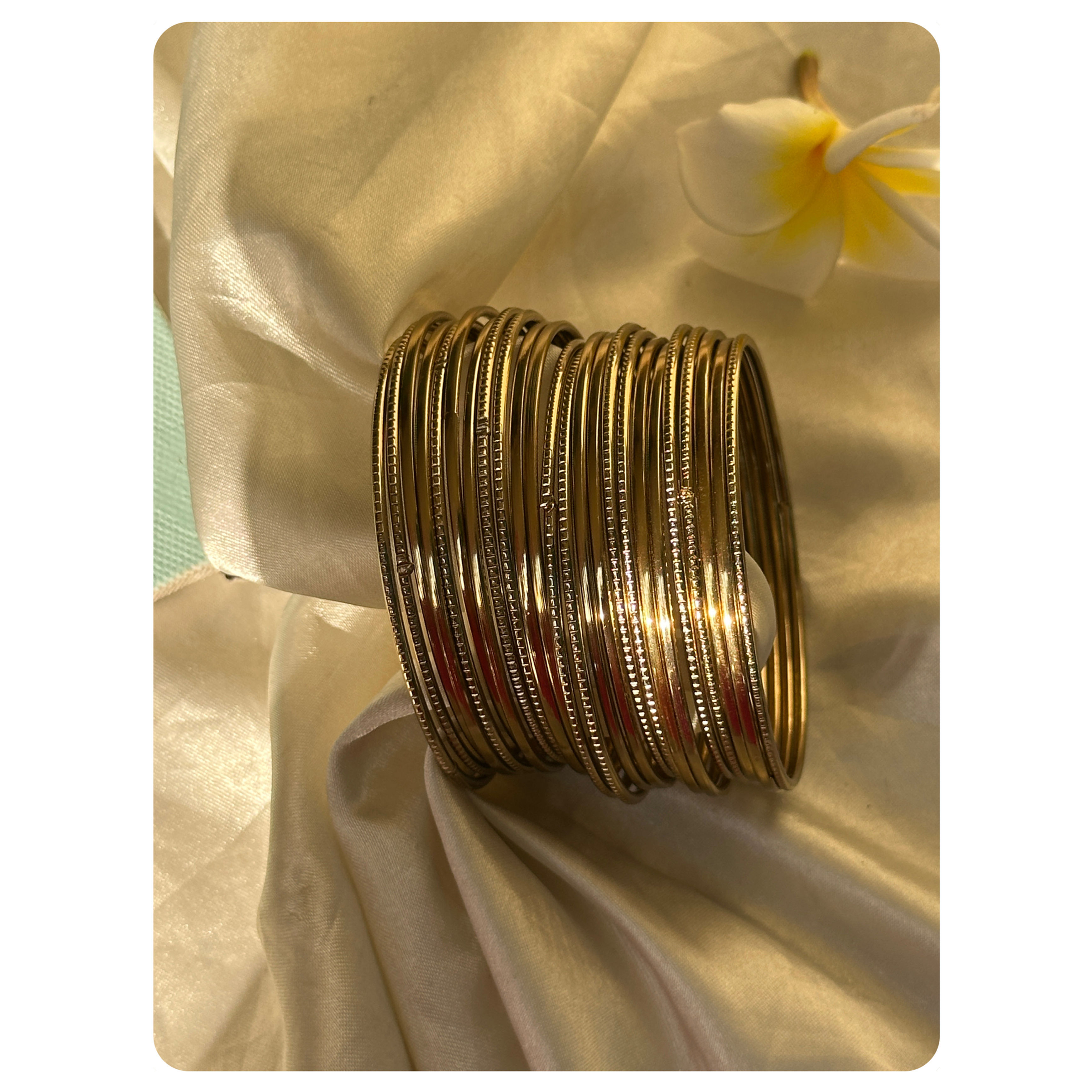 Gold Toned Sleek and Striped Bangle Set (24 pieces) Size- 2.8