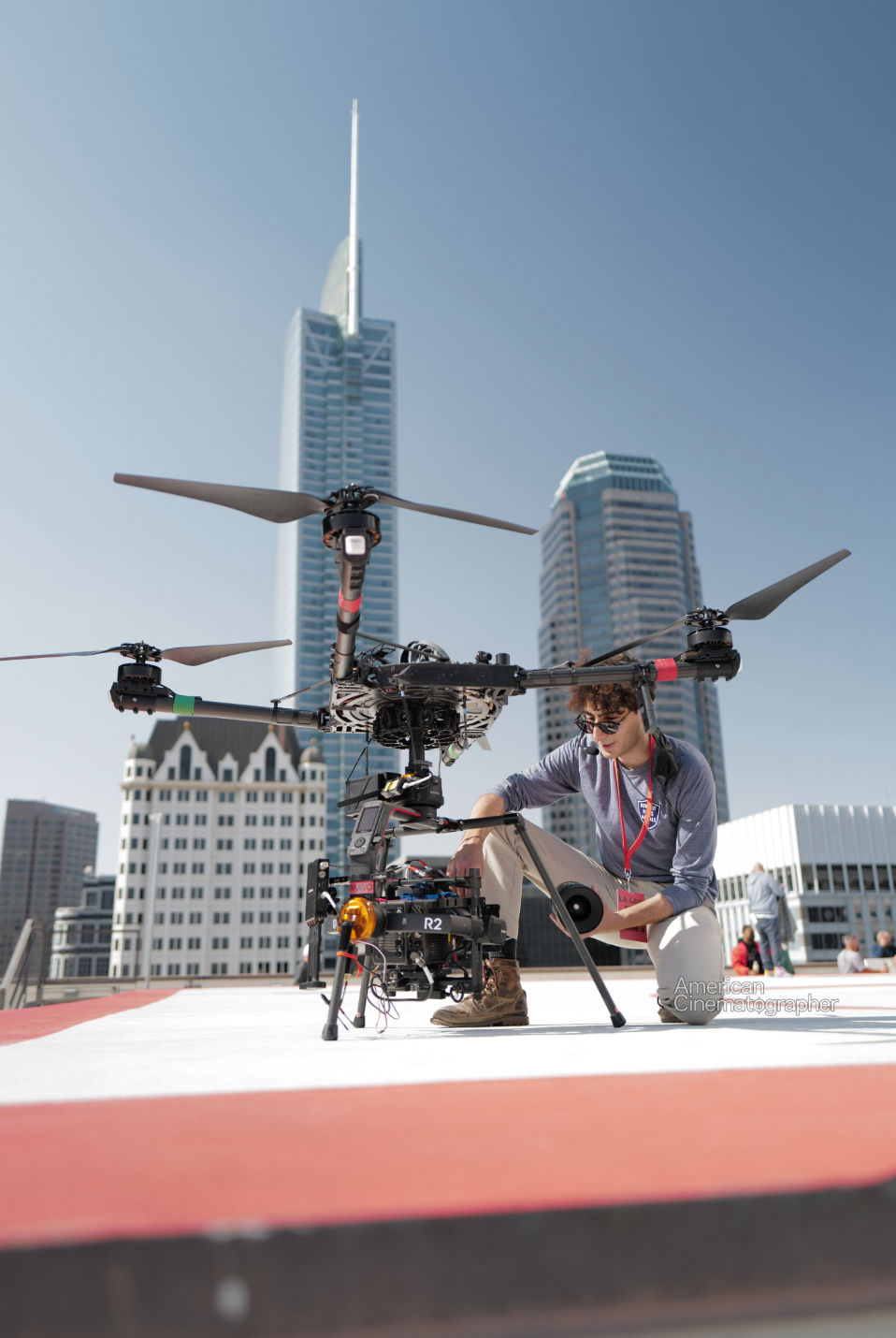 Beverly Hills Aerials 1st AC and aerial cinematographer Majd Mazin swapping Arri Signature Primes on the helipad of a downtown Los Angeles skyscraper during production of a television show
