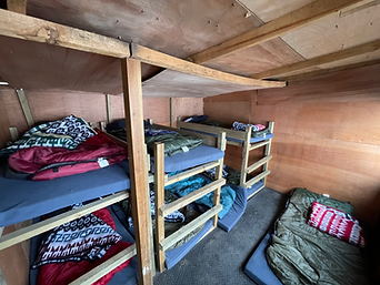 Cabin image indicating warm indoor sleeping arrangements