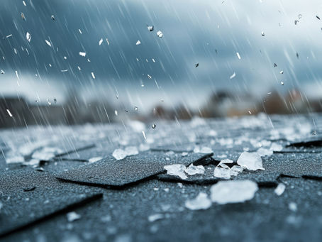 Hailstones pelt a rooftop, crafting a dramatic scene beneath the dark, stormy skies.