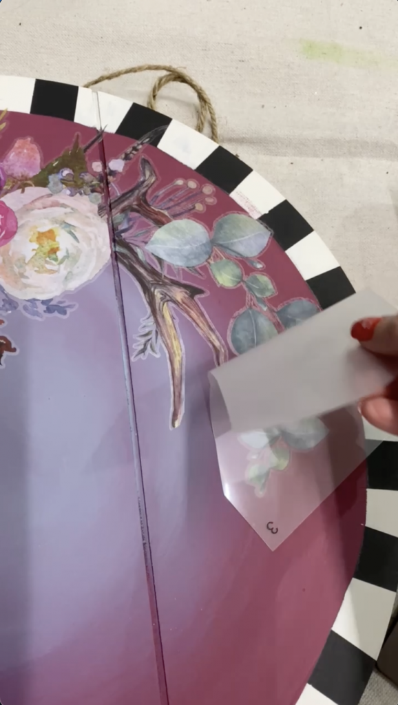 Tracey's Fancy applying a design transfer to her DIY door hanger