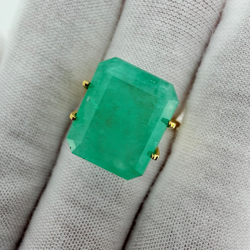 Thumbnail: Colombian emerald gemstone displayed on white glove