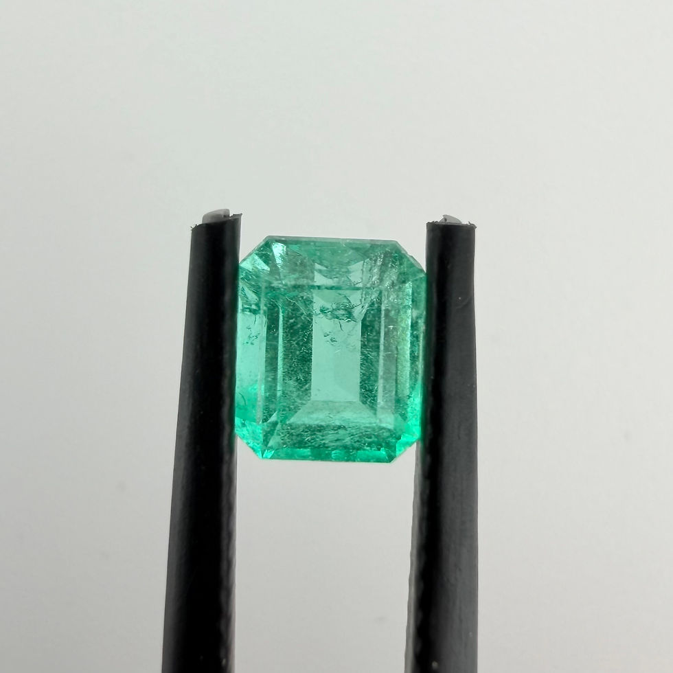 Thumbnail: Loose 1.25 ct Colombian emerald shown in tweezers