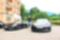 Happy man with luxury cars in European trip