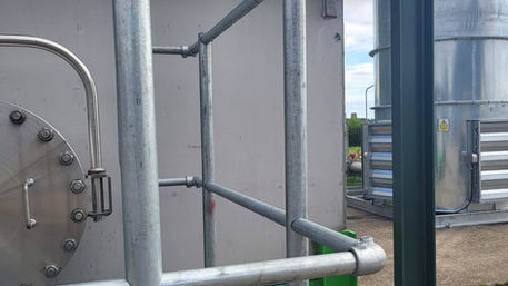 Elevated unit with safe access rails