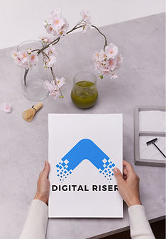 Isla McGill holding digital riser flyer, engaging with a client in a professional setting