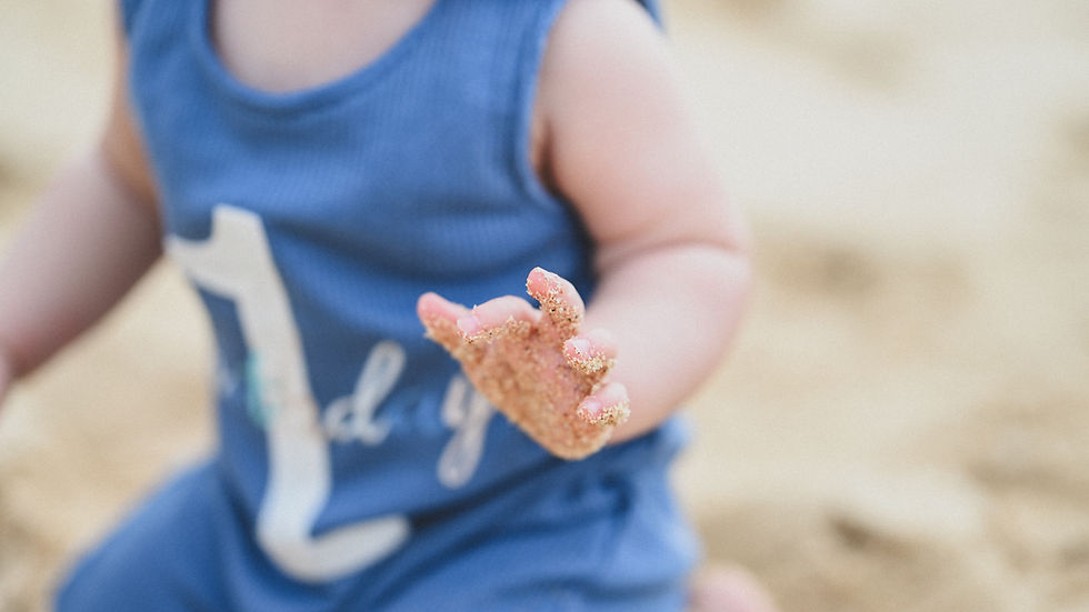 A serene family moment captured in the golden light of Hawaiʻi, where laughter dances on the breeze and love envelops the scene.