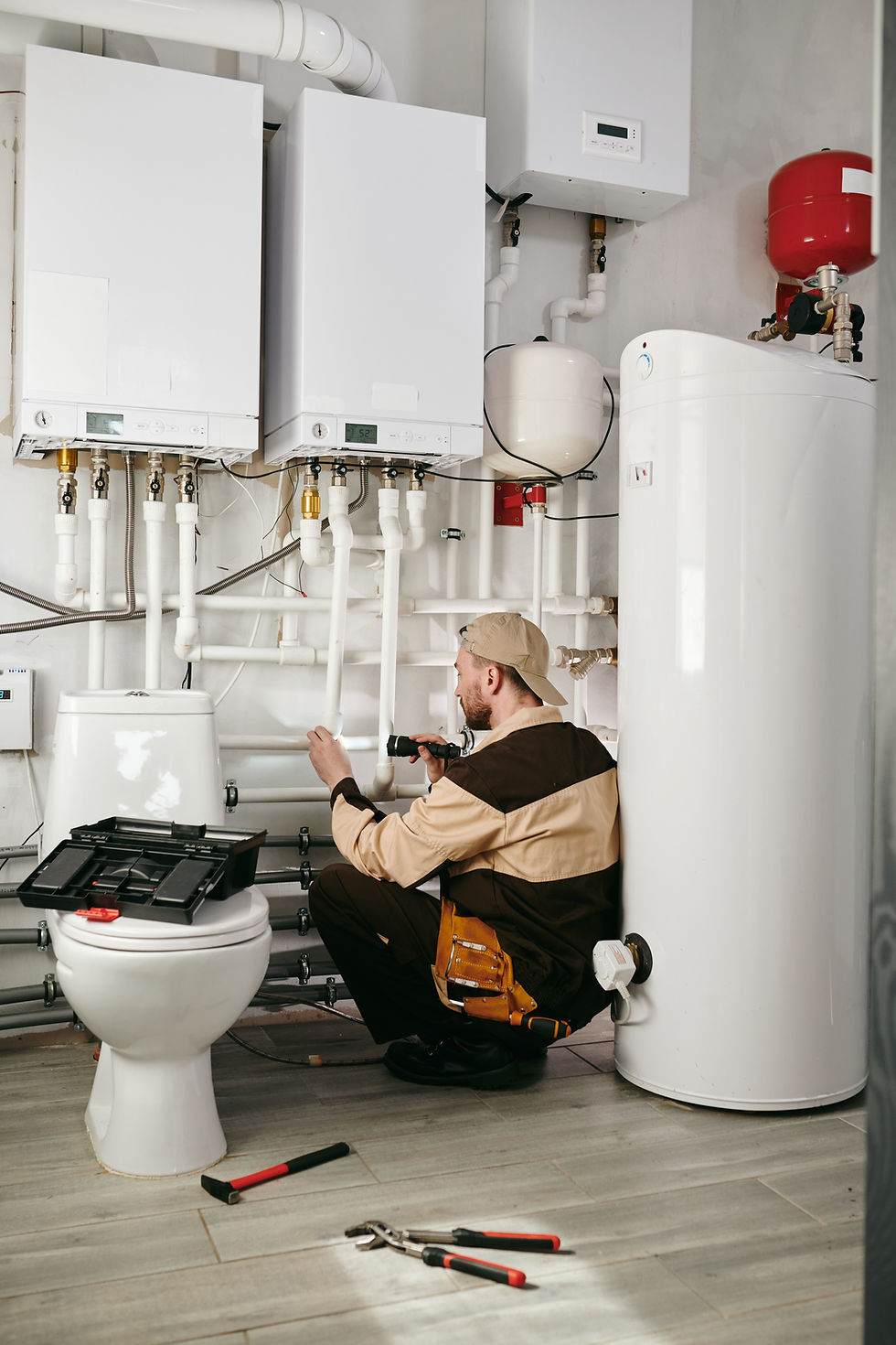 hvac technician checking different water heaters