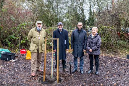 Planting a Tree of Hope at the Minnie Pit Memorial Garden