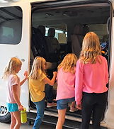 kids getting on van square.png