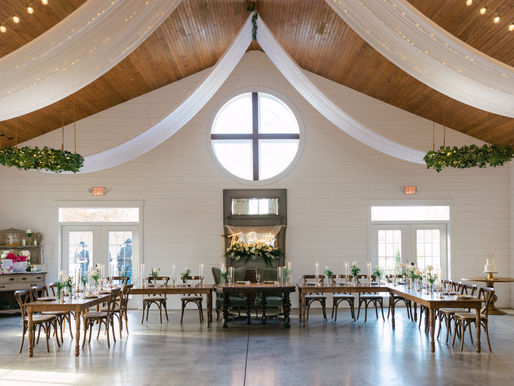 Daniel’s Ridge wedding reception with white flowers, greenery and candlelight in Sanford, NC