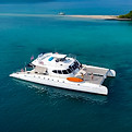 Spacious catamaran hosting a private event with guest dancing on deck