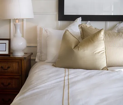 Hotel bed white and gold.webp