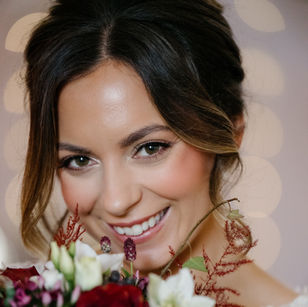Bride with brunette updo wearing soft glam bridal makeup