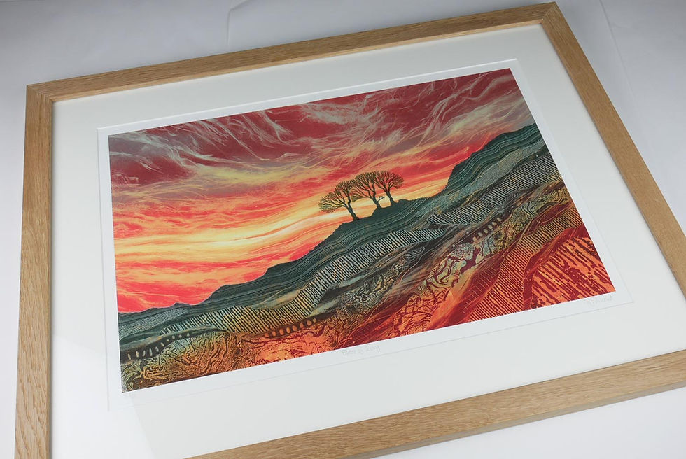 Thumbnail: Blaze of Glory sunset sky with trees on a rocky hillside. Rebecca Vincent prints