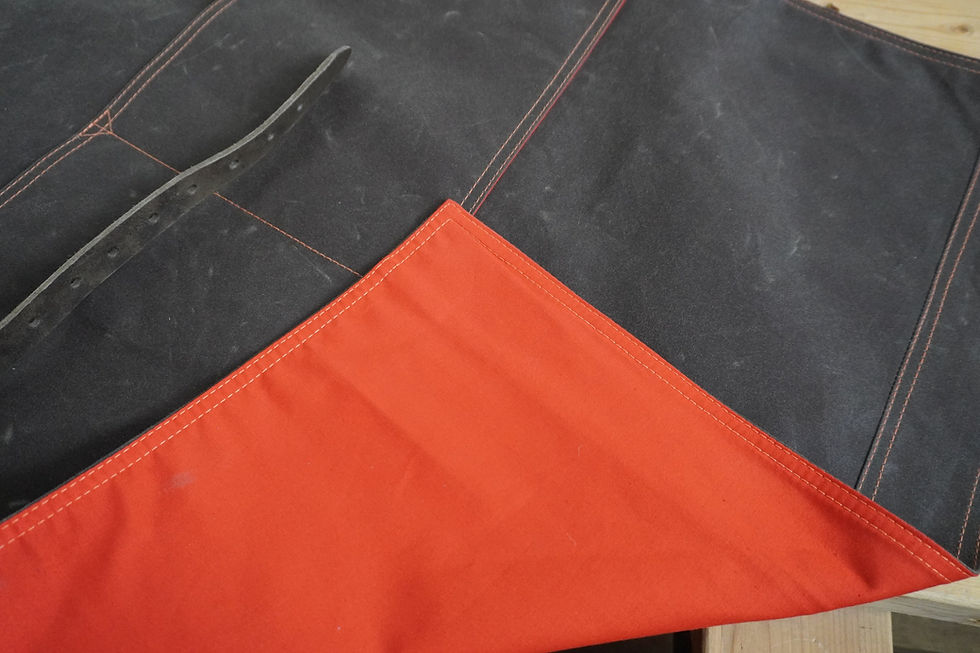 Thumbnail: Product shot of a waxed cotton and leather Apron by 1874 Works