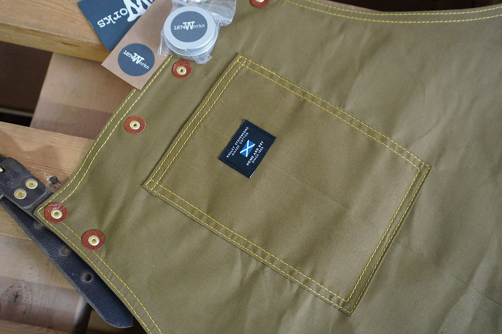Product shot of a Waxed cotton and leather apron by 1874 Works