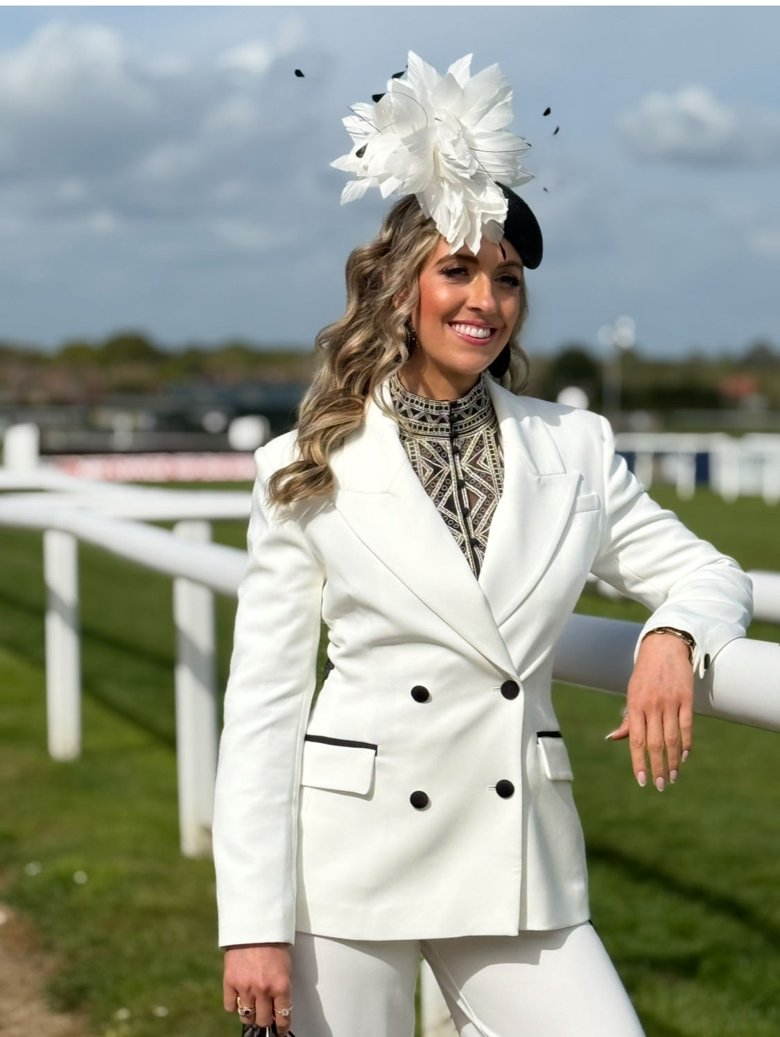 Black & white teardrop with feathers. To hire 